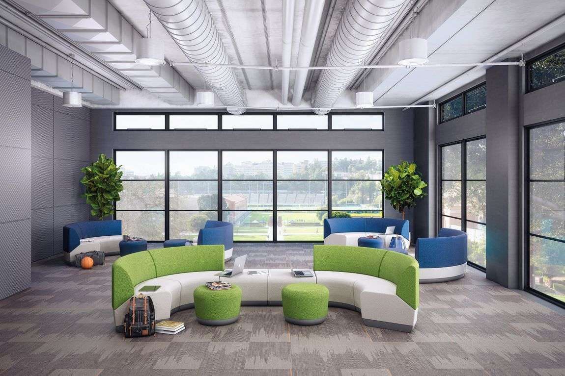 Bright and colorful office space with collaboration furniture and occasional tables.