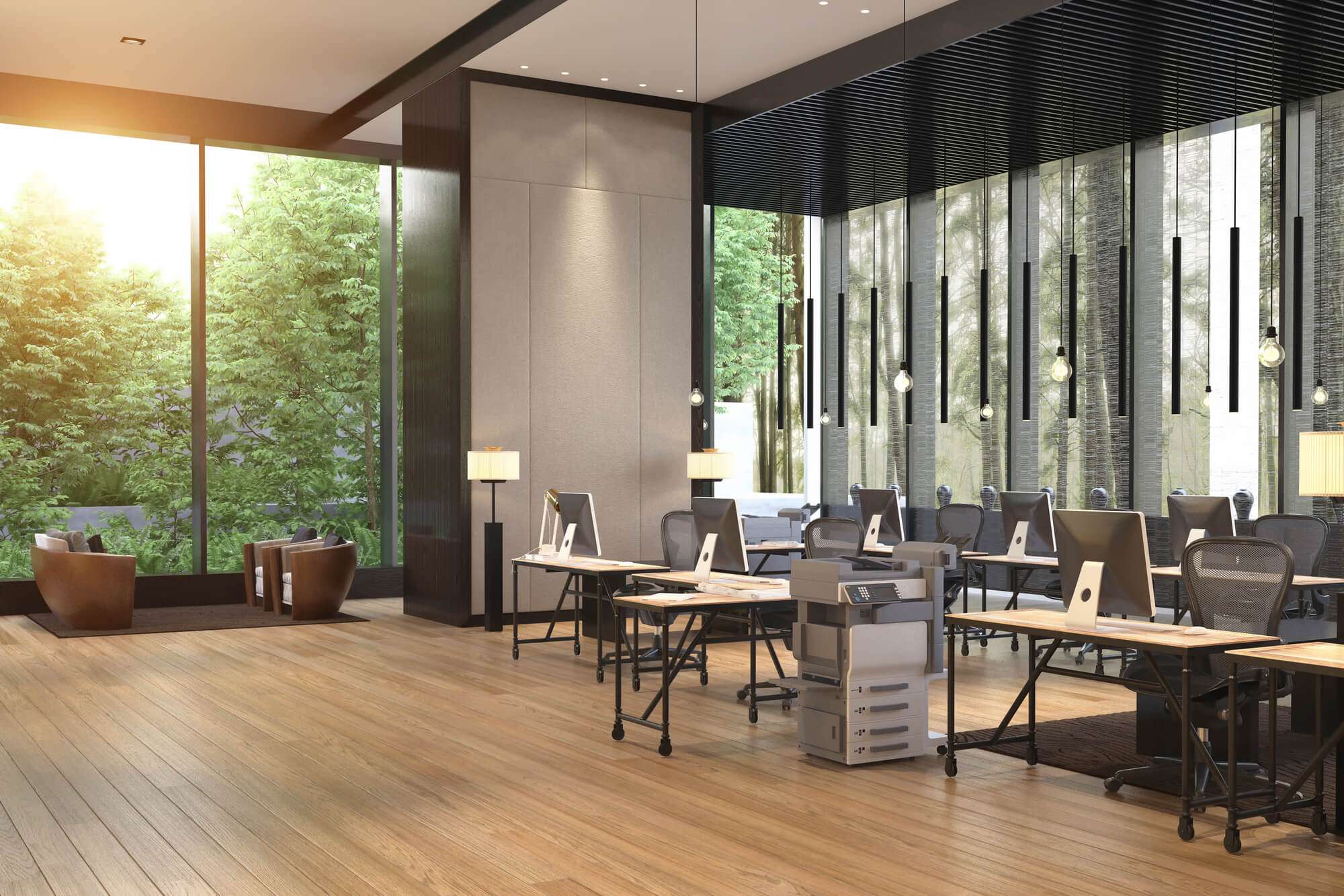 Bright coworking space with monitors, desks, and couch