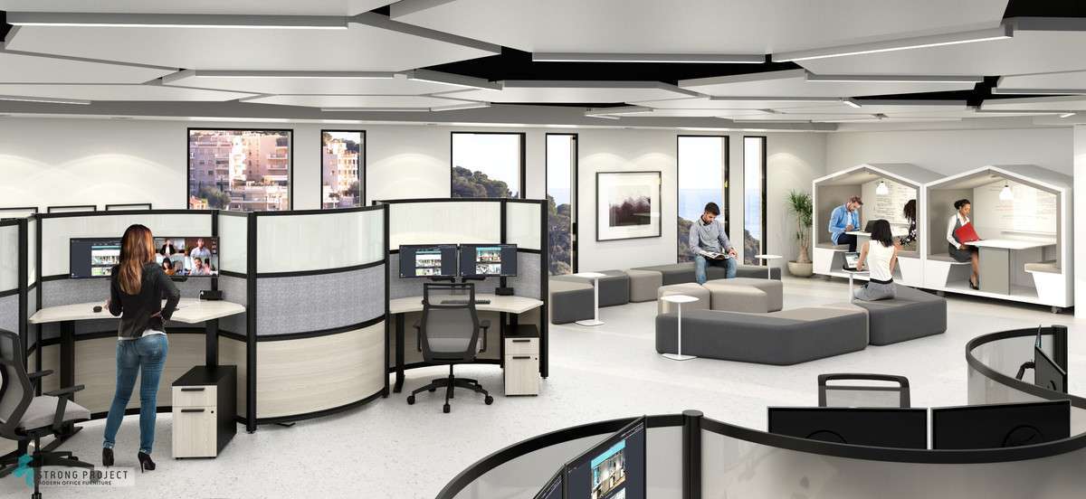 adjustable height desk in a hybrid office with modern curved cubicles and collaborative lounge seating and employee phone booth