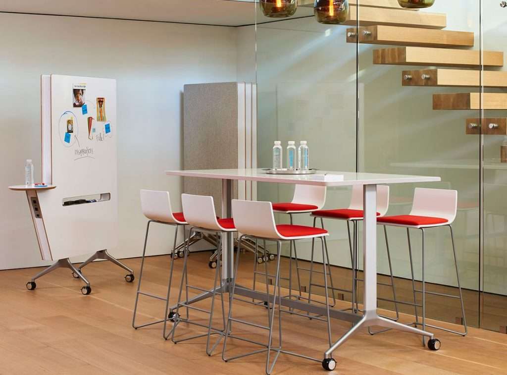 office color psychology in a conference room with a mobile conference table and movable acoustic partitions