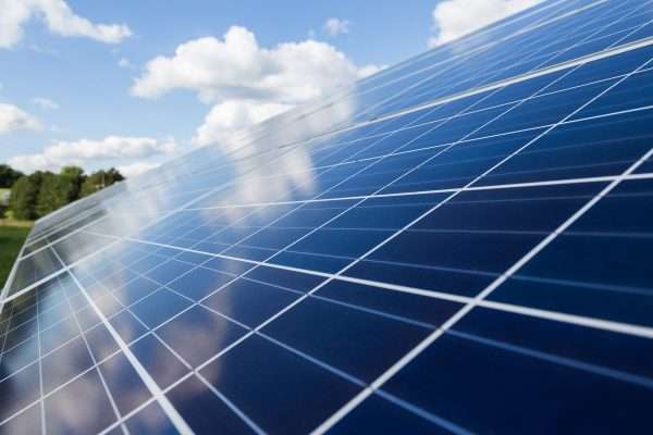 solar panels in an open field representing one of the top 5 emerging industries